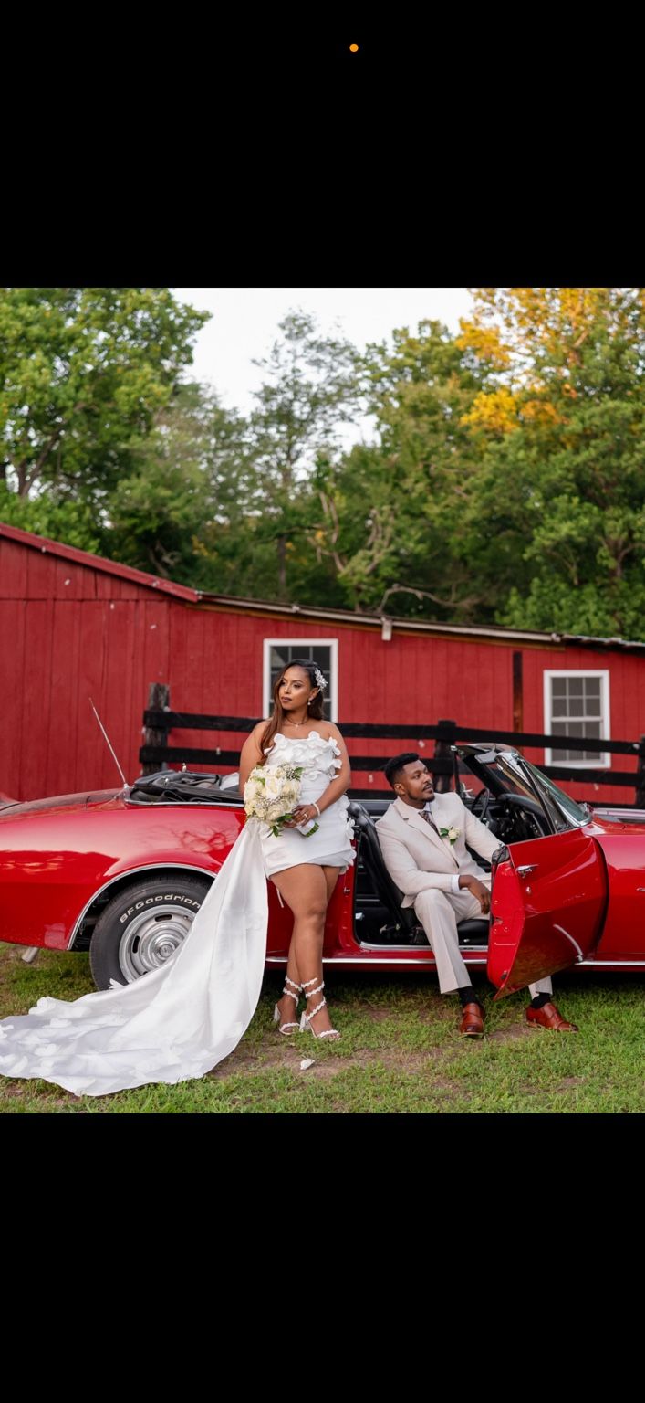 Meskerem and Tariku with the red convertible